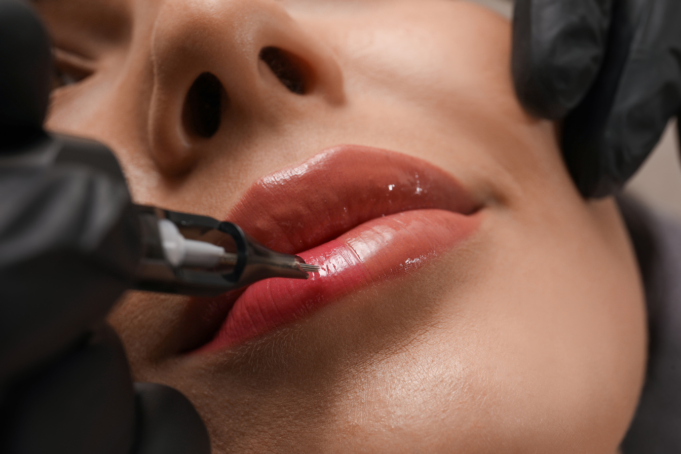 Young Woman Undergoing Procedure of Permanent Lip Makeup in Tatt